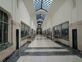 Long shot of a long hallway with ceiling skylight