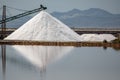 Saltmine pile with machines and water reflection Royalty Free Stock Photo