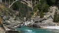 Long shot of the shotover jet and the hstoric edith cavell bridge