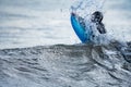 Long shot of unrecognizable surfer breaking the wave Royalty Free Stock Photo