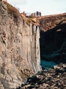 Viewpoint with tourists over basaltic columns and river canyon Royalty Free Stock Photo