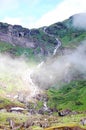 Long shot of a water coursing down a bed of rocks Royalty Free Stock Photo