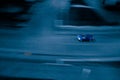 Long shutter photo of car in city track. Motion blur concept