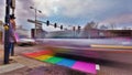 Lgbt rainbow colors crosswalk with drivng car and pedestrian