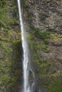 Long skinny waterfall coming down a mountain