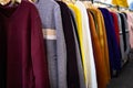 Long sleeved t-shirt many colours hanging on the rack,comfortable clothes and cheap,variety of popular fashion clothes in asian Royalty Free Stock Photo