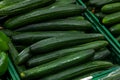 Long, smooth, green cucumbers laid out horizontally on the count Royalty Free Stock Photo