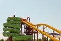 Long spiral and straight water slides in the outdoors seasonal water park at day time