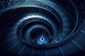 Long spiral, winding stairs. Dark shadows, soft light. Royalty Free Stock Photo