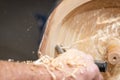 Long spiral wood shavings while making a wooden bowl