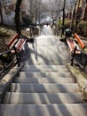 Long stair with intermediate landings and benches Royalty Free Stock Photo