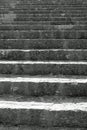 long staircase with gray stone steps that rises towards infinity