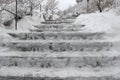 Long stairs covered with a layer of Snow. Watch out for ice.