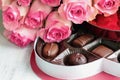 Long Stem Pink Roses with a Heart Shape Box of Chocolate Candy Royalty Free Stock Photo