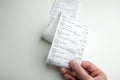 A long store receipt in hand, food expenditure analysis