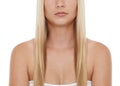 Long, straight locks. Cropped studio shot a model with long blond hair isolated on white. Royalty Free Stock Photo