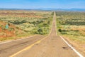 Long straight road disappearing into distance