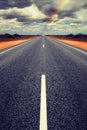 Long Straight Road with Gathering Storm Clouds