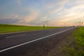 Long straight road leading into the sunset Royalty Free Stock Photo