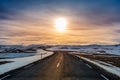A long straight road at sunset in winter Royalty Free Stock Photo