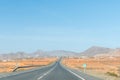 Fuerteventura, Spain - October 3 2023: Long straight road in the middle of Canary desert