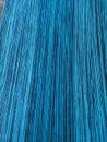 Long strands of blue yarn