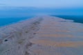 Long strech of sand dunes near the ocean at dawn.