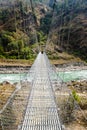 Long suspension bridge in rural Nepal Annapurna Circuit