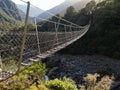 Long swing bridge over Copland river, New Zealand Royalty Free Stock Photo