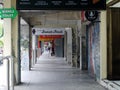 a long, symmetrical alley in front of a shopping center in Indonesia.