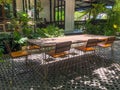 Long table and chairs at empty cafe with sunlight,relaxation concept Royalty Free Stock Photo