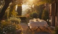 Long table served with luxury tableware, wine glasses, candles under old olive tree branches in deep Italian countryside sunset