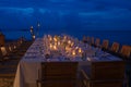 Long table wedding dinner setup on the beach. Royalty Free Stock Photo