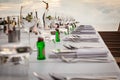 Long table wedding dinner setup on the beach. Royalty Free Stock Photo