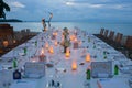 Long table wedding dinner setup on the beach. Royalty Free Stock Photo