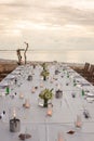 Long table wedding dinner setup on the beach. Royalty Free Stock Photo