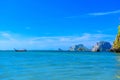 Long tail boat in bay of sea with rocks cliffs in background, Tonsai Bay, Railay Beach, Ao Nang, Krabi, Andaman sea, Thailand Royalty Free Stock Photo