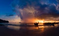 Long tail boat at Sunset on the beach of Ao Nang in Krabi