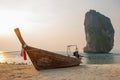 Long tail boat on tropical beach with limestone rock. Sunset, island Taming. Krabi, Thailand. Royalty Free Stock Photo