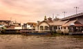 Long tail boat waiting to pick up passengers from Pak Kret pier to Koh Kret. Royalty Free Stock Photo