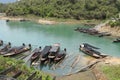 Long tail boats docked at the Ratchaprapha Dam port (Cheow Lan lake) in the Khoa Sok National Park Royalty Free Stock Photo