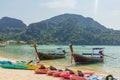 Long-tail boats and kayaks parked at the tropical bay in Thailand. Ocean. Asia. Royalty Free Stock Photo