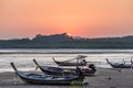 Long-tail boats at low tide at sunset, Phang-Nga Bay, Thailand Royalty Free Stock Photo