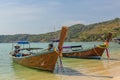 Long-tail boats parked at the tropical bay in Thailand. Ocean. Asia. Sunny day. Royalty Free Stock Photo