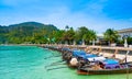Long tail boats are parking at Tonsai pier, Ko Phi Phi islands, Thailand. Summer weather, concept of tropical vacation in paradise Royalty Free Stock Photo