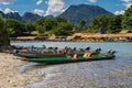 Long tail boats on sunset at Song river, Vang Vieng, Laos. Royalty Free Stock Photo