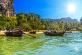 Long tail boats on tropical beach with palms, Tonsai Bay, Railay Royalty Free Stock Photo