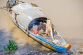 Long-tail Mekong boat with a Cambodian Muslim woman living on it