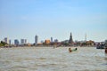 Long tail motor boat cruise in front of Wat Arun in Chaopraya ri