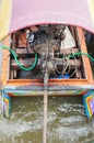 Long tail wooden boat engine on the river